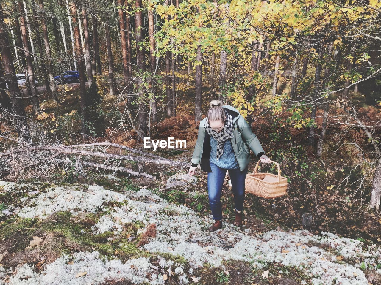 MAN STANDING IN FOREST