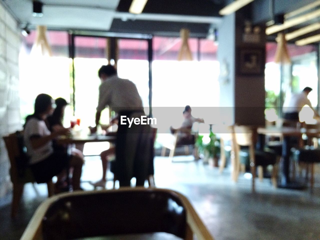 PEOPLE WORKING ON CHAIR IN KITCHEN