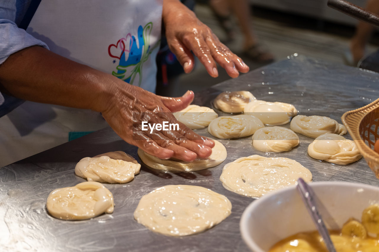 MIDSECTION OF PREPARING FOOD