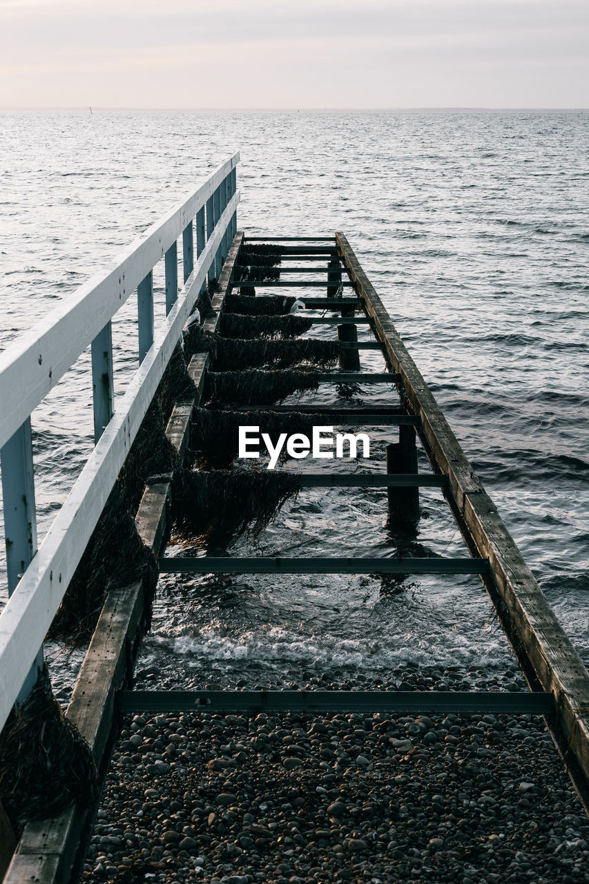 High angle view of pier over sea against sky