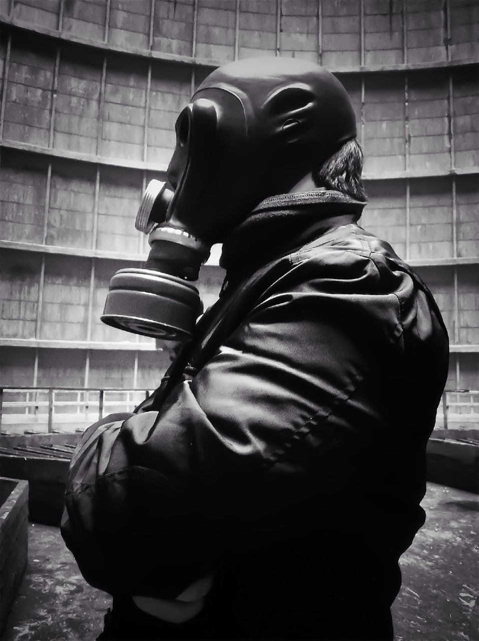 Close-up of man wearing mask in building