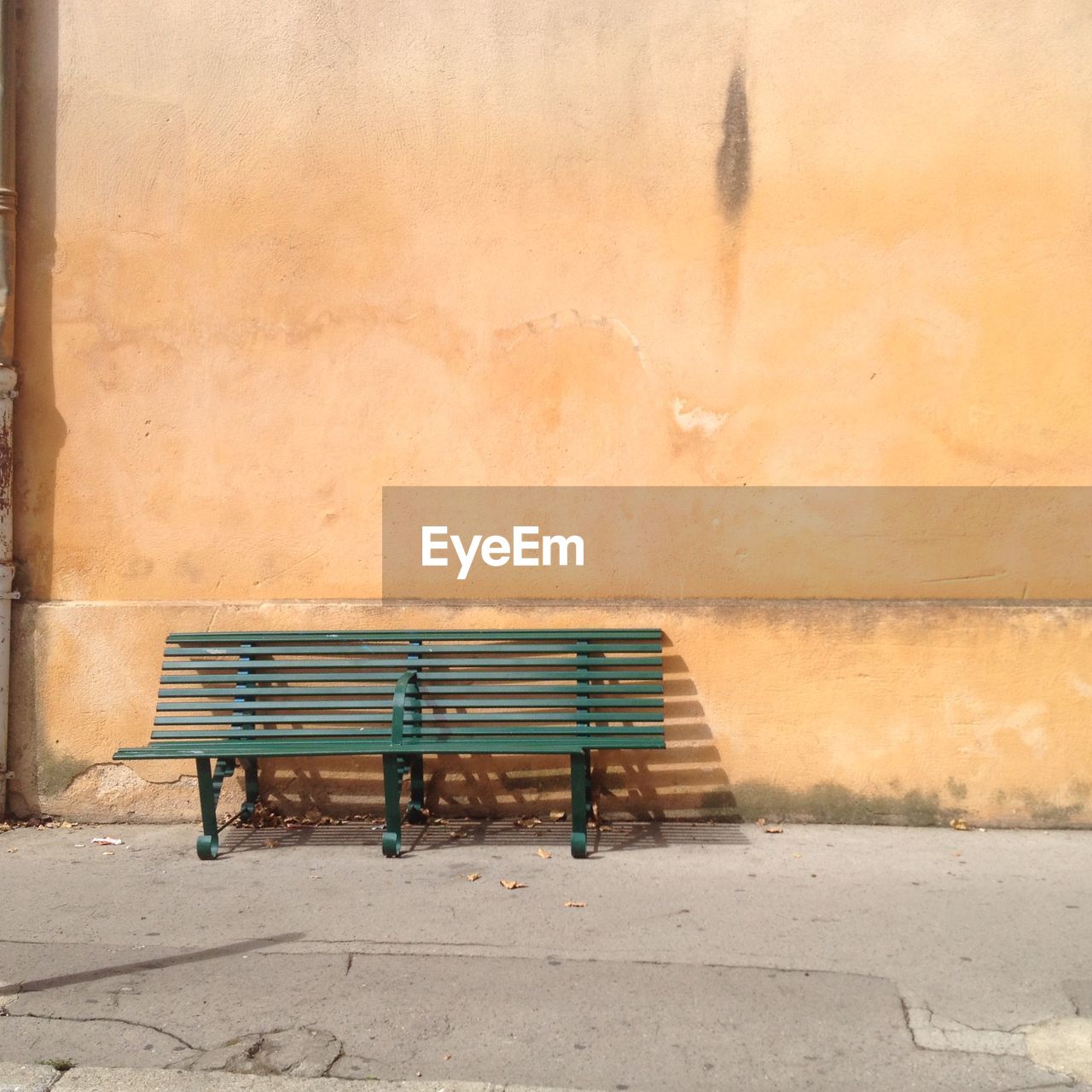Bench against wall on floor