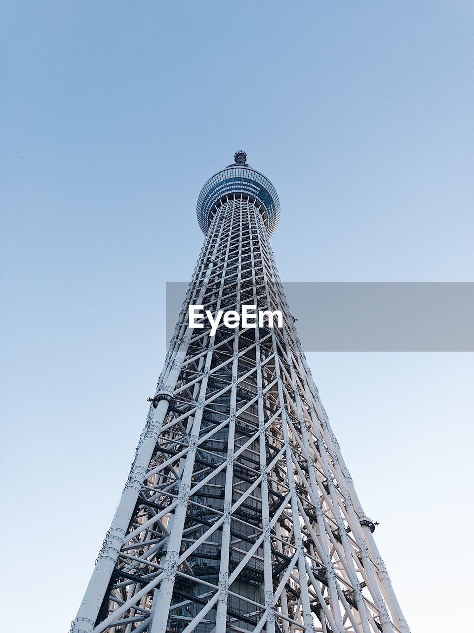 Low angle view of communications tower against clear sky