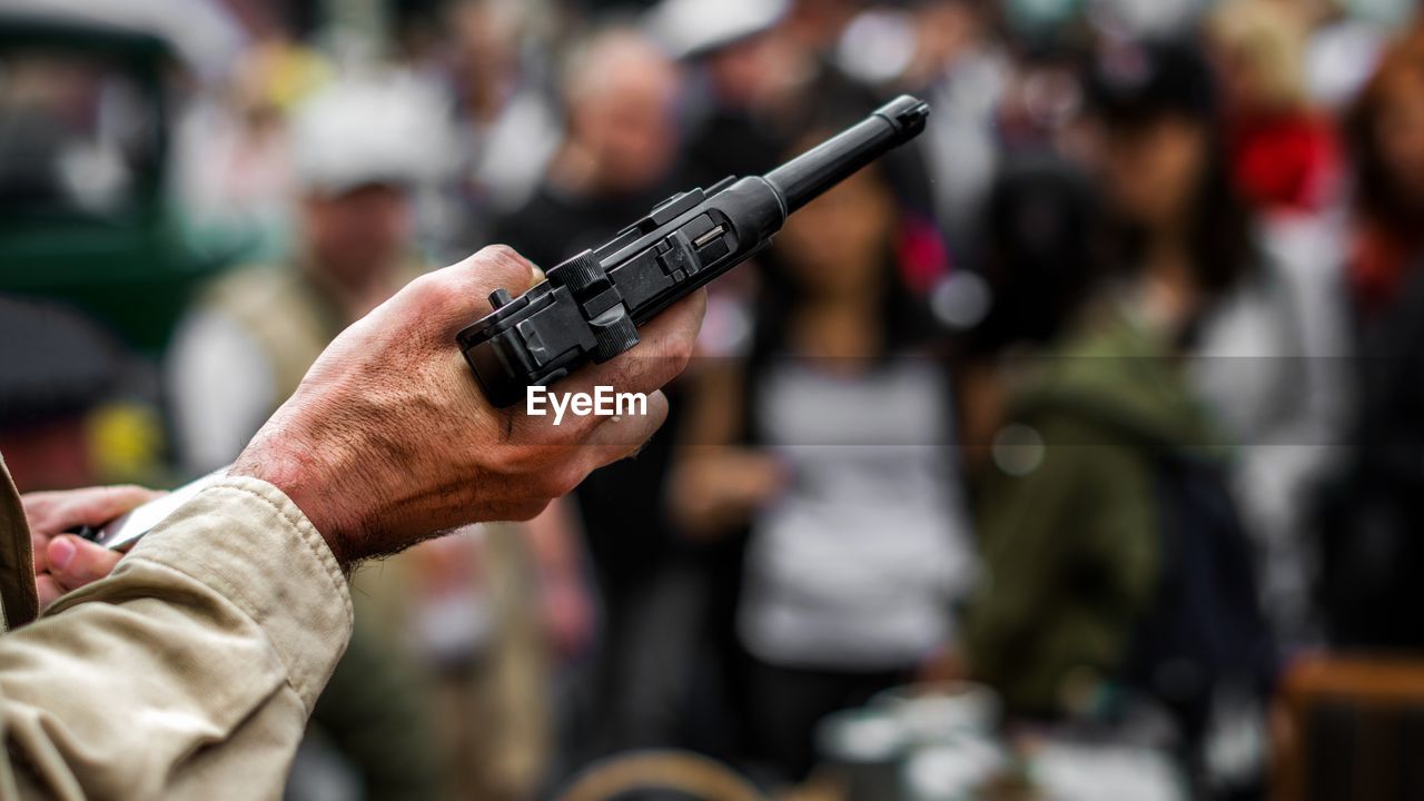 Close-up of man with gun