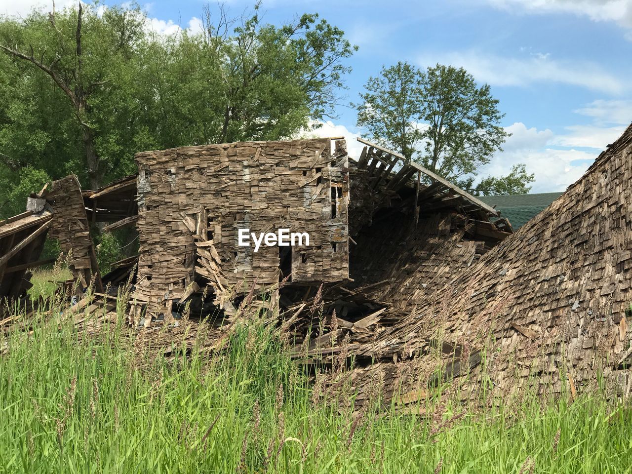 ABANDONED BUILT STRUCTURE IN FIELD