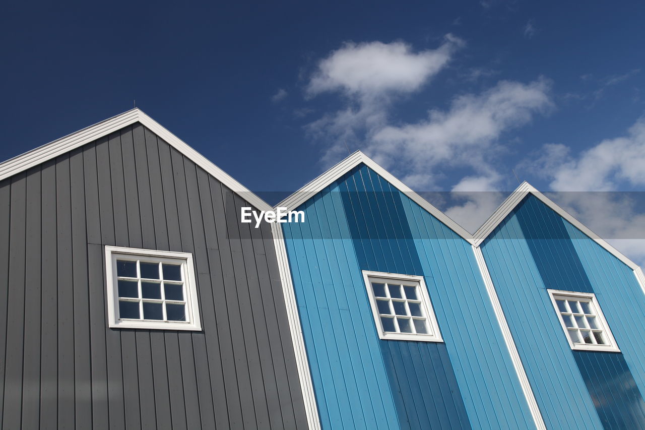 Low angle view of building against blue sky