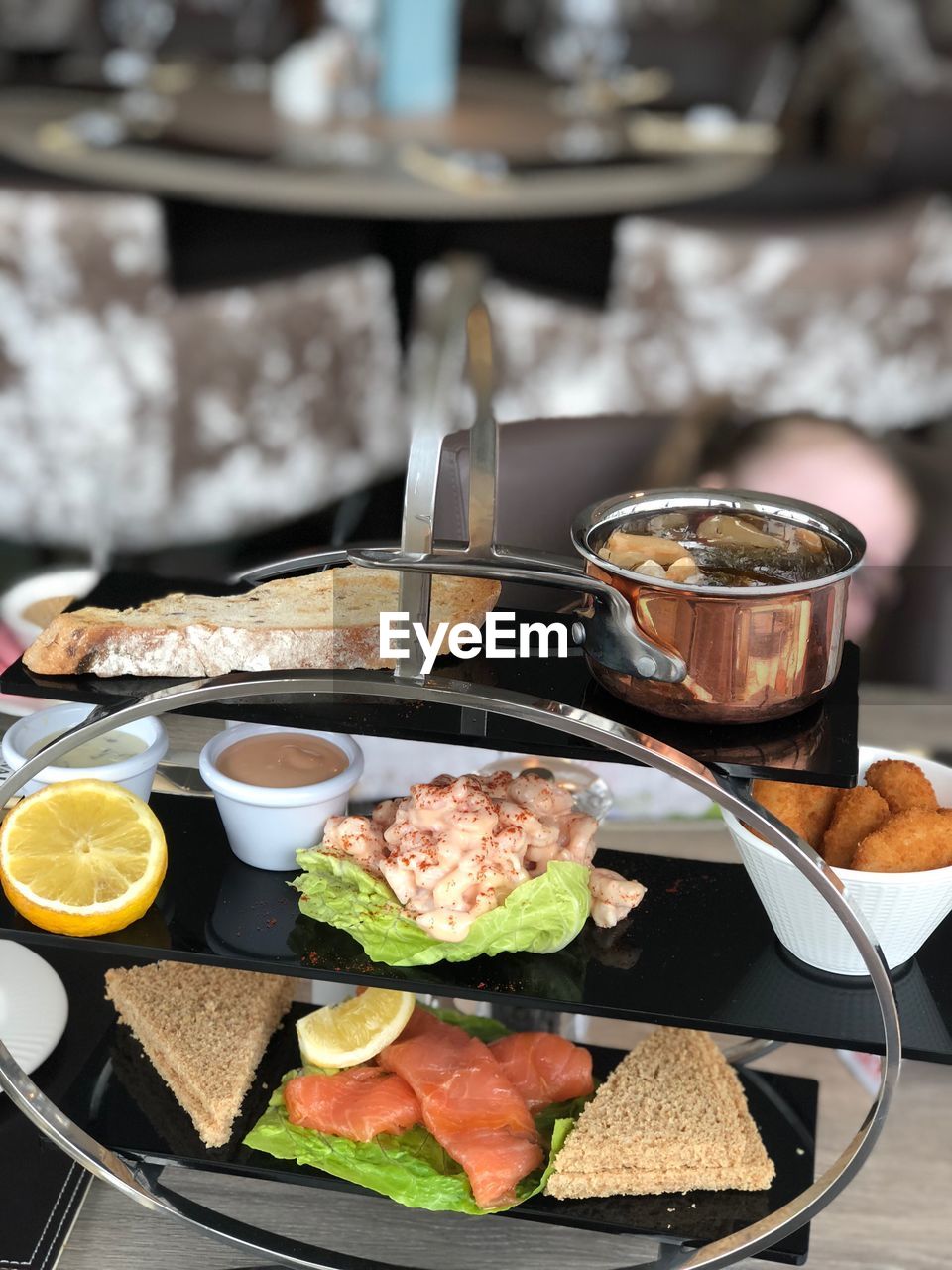 Close-up of breakfast served on rack in restaurant