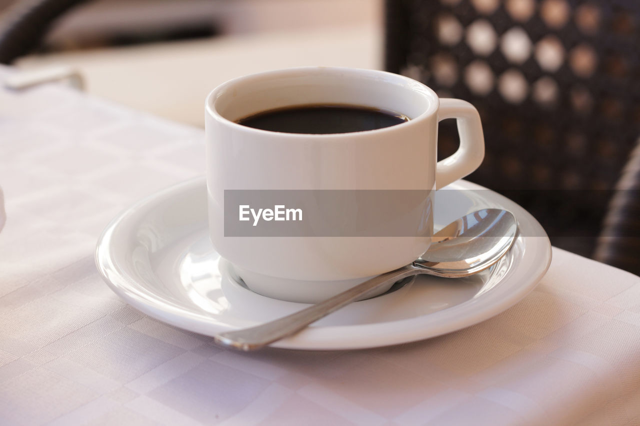 CLOSE-UP OF COFFEE CUP AND TEA