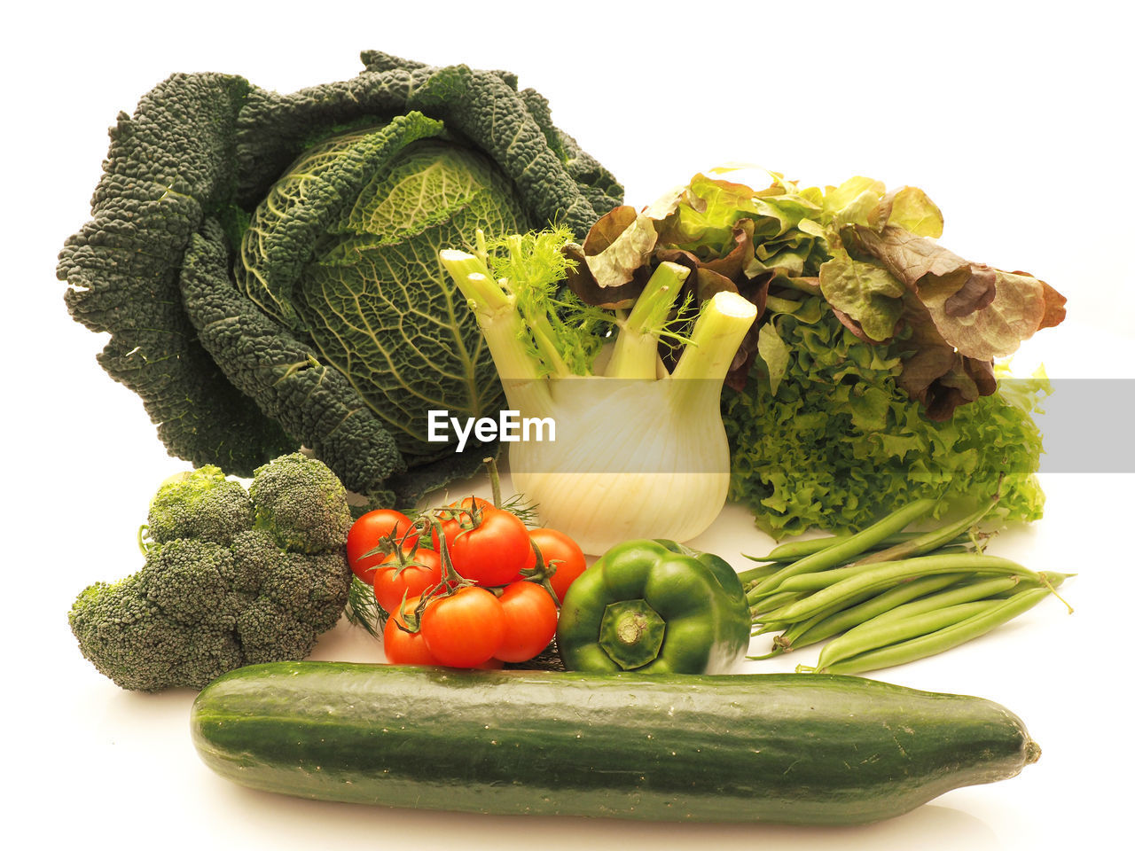 Variety of fresh vegetables over white background