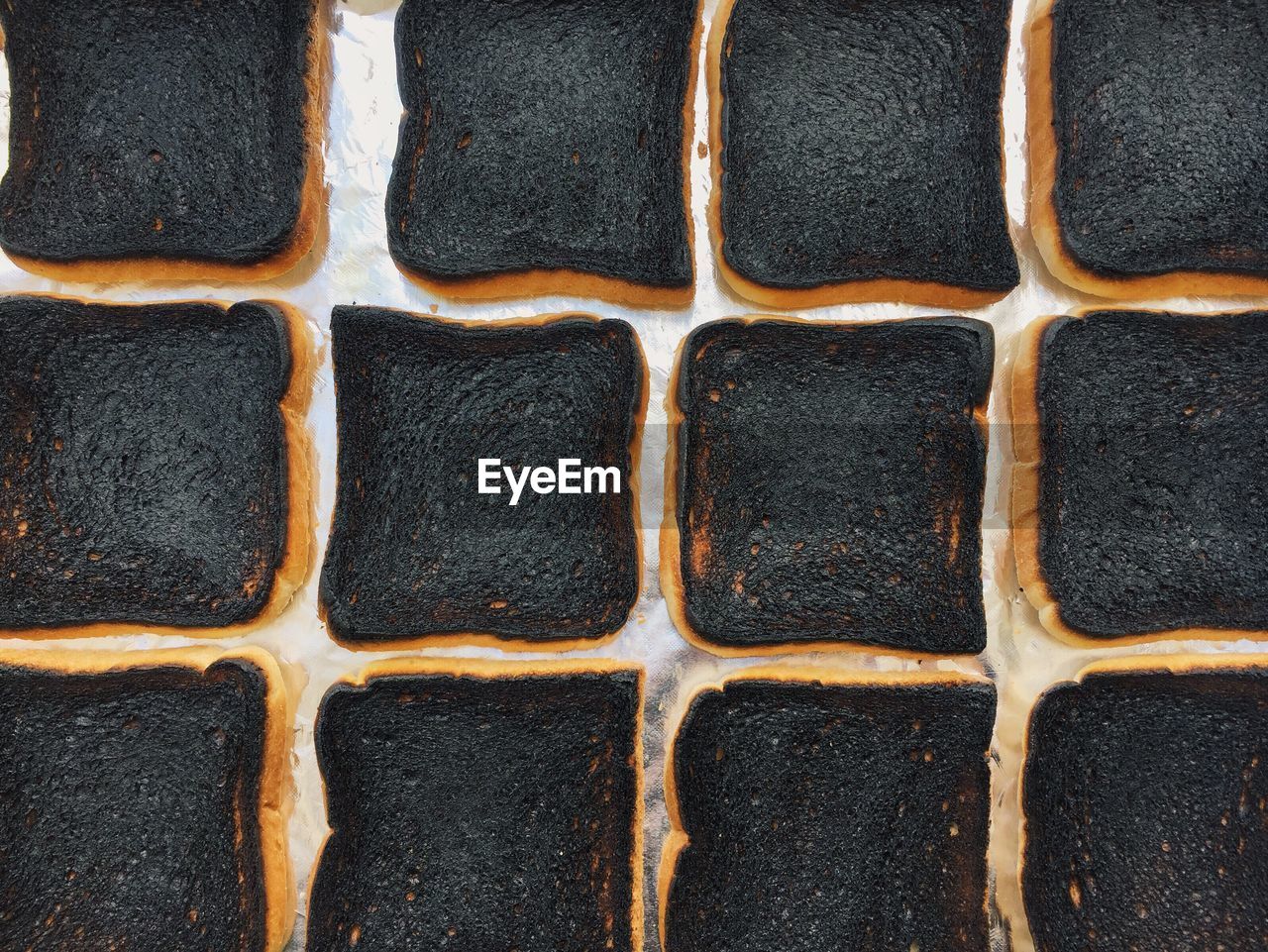 Full frame shot burnt bread on table