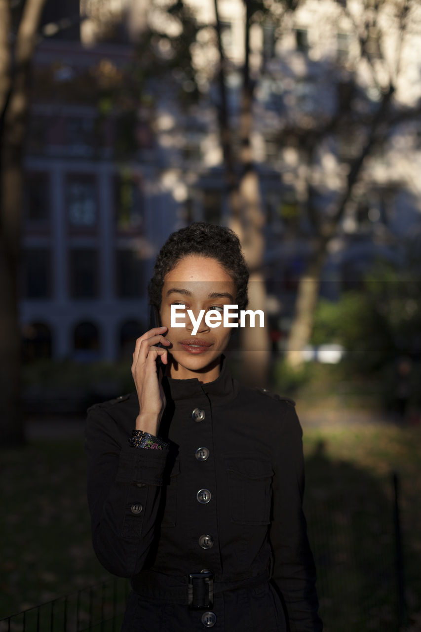 Young woman talking on her cell phone