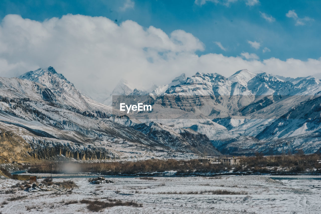 Scenic view of snowcapped mountains against sky