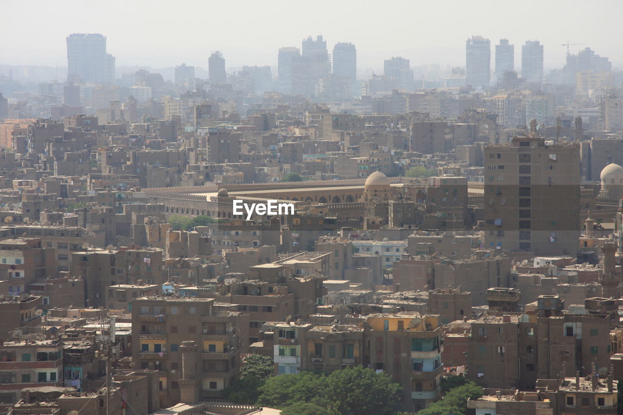 High angle view of buildings in city against sky