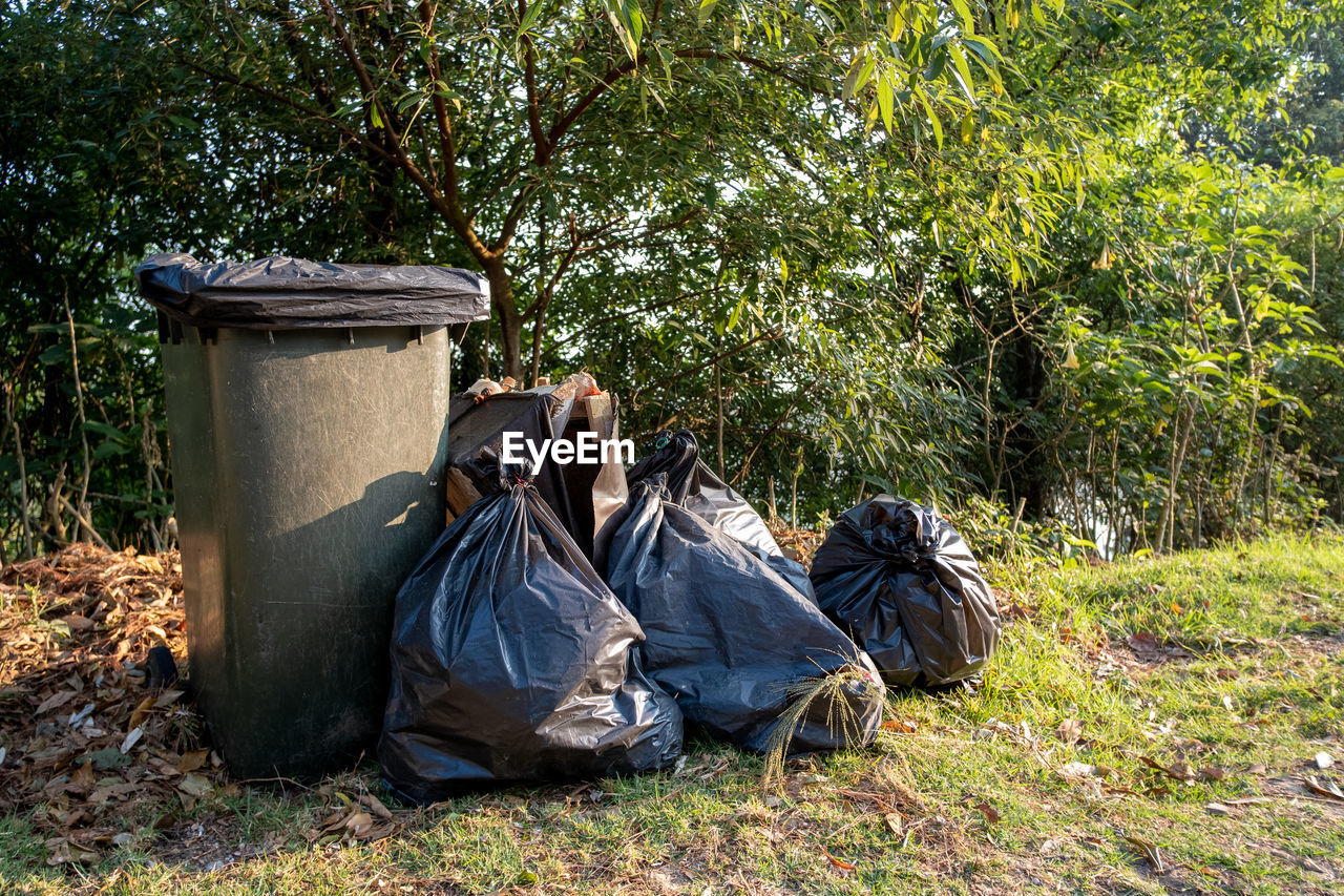 GARBAGE BIN IN FIELD