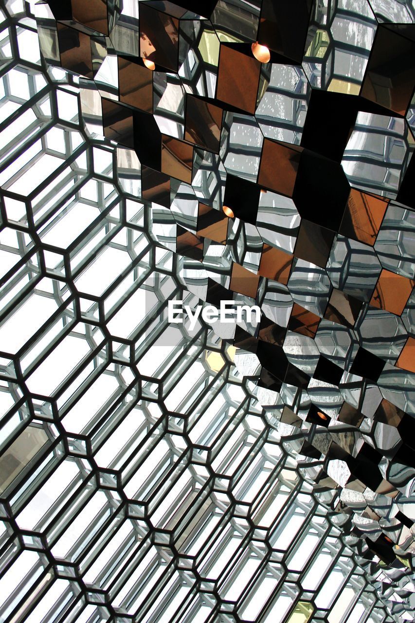 Low angle view of patterned glass ceiling at harpa