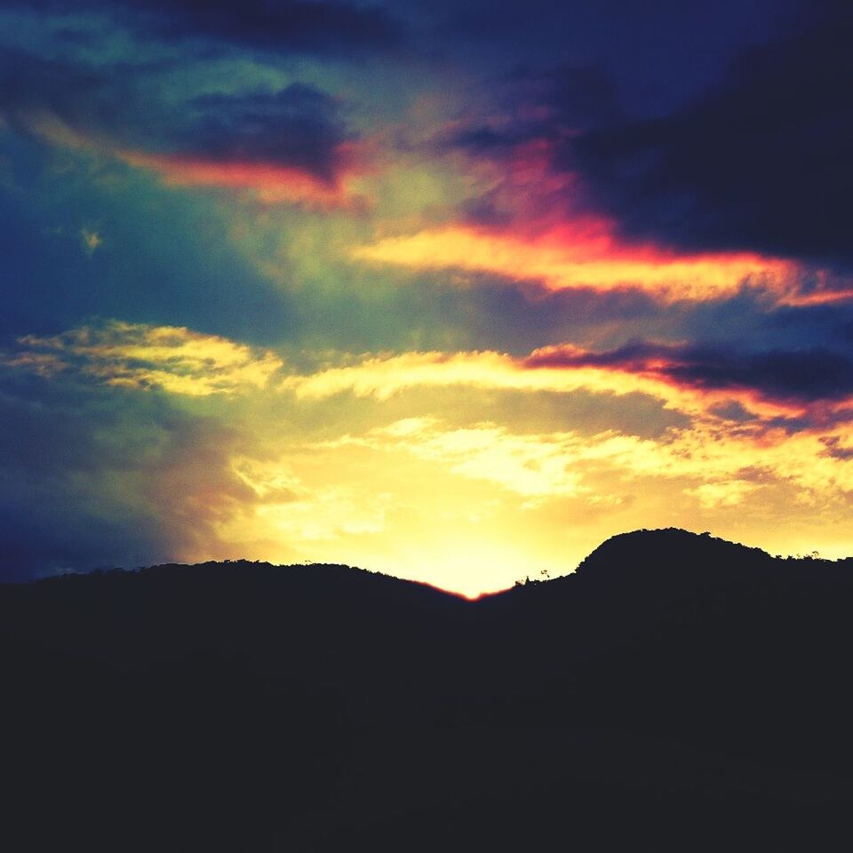 Silhouette landscape against scenic sky