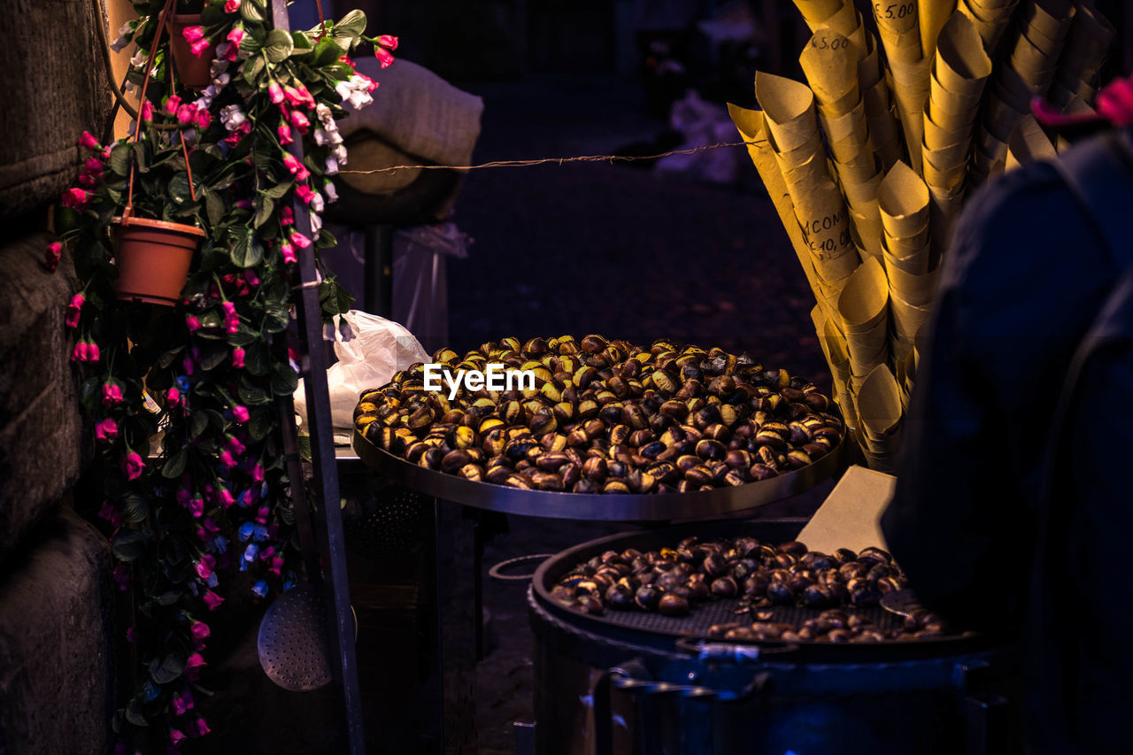 Midsection of man selling food at night