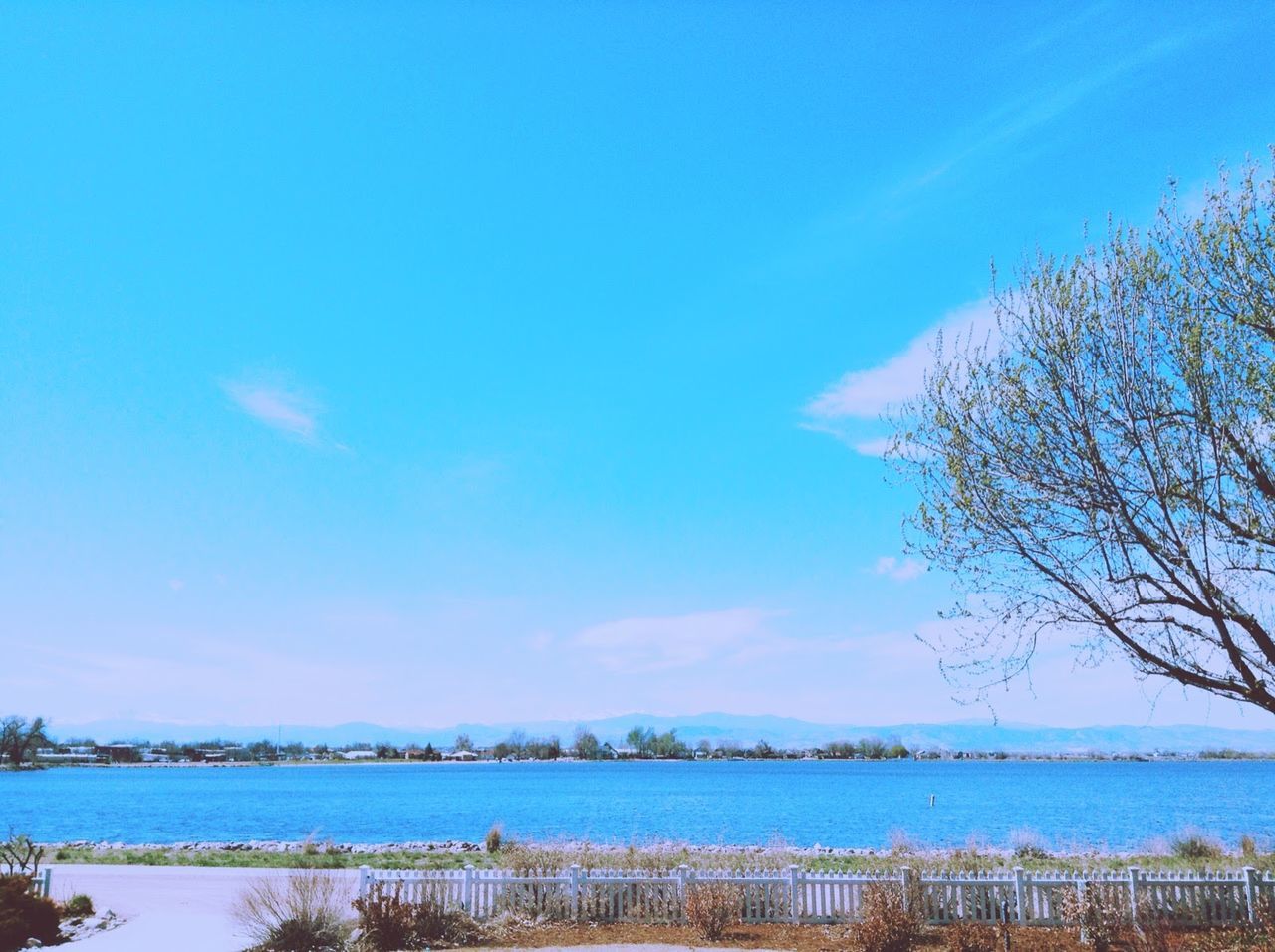 Scenic view of sea against blue sky