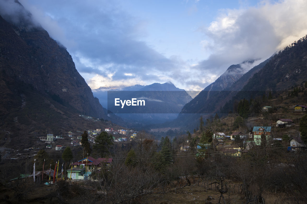 Scenic view of landscape and mountains against sky