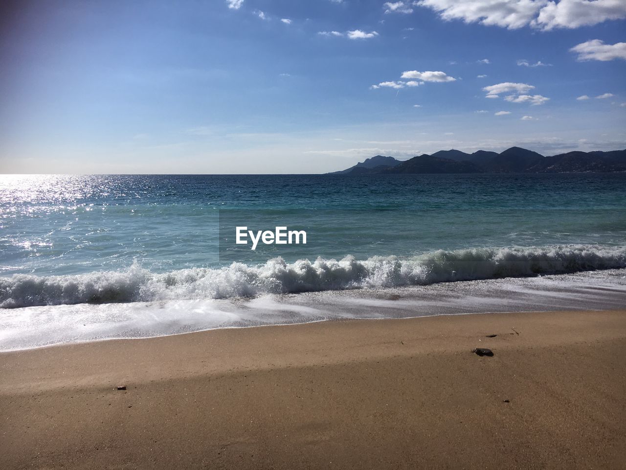 Scenic view of beach against sky