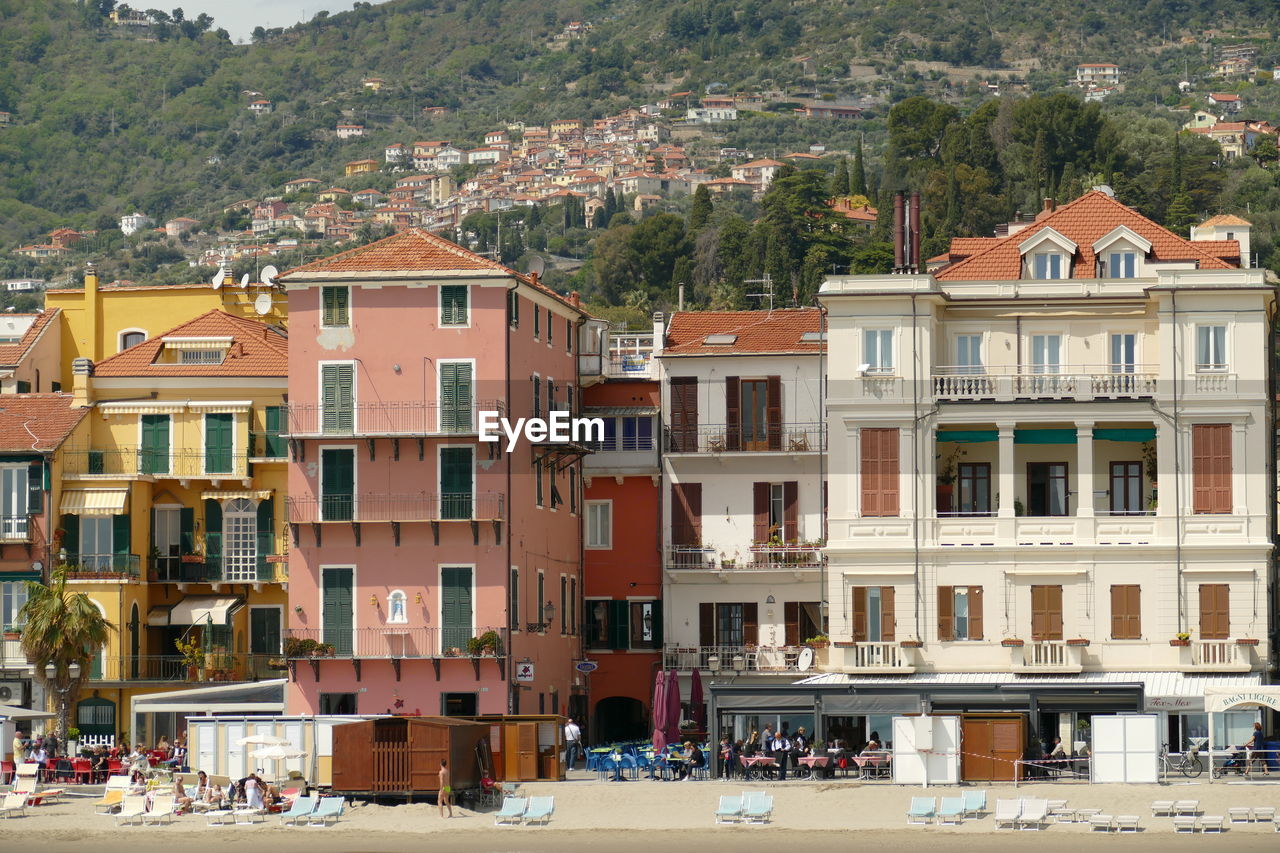 Buildings in town against mountain