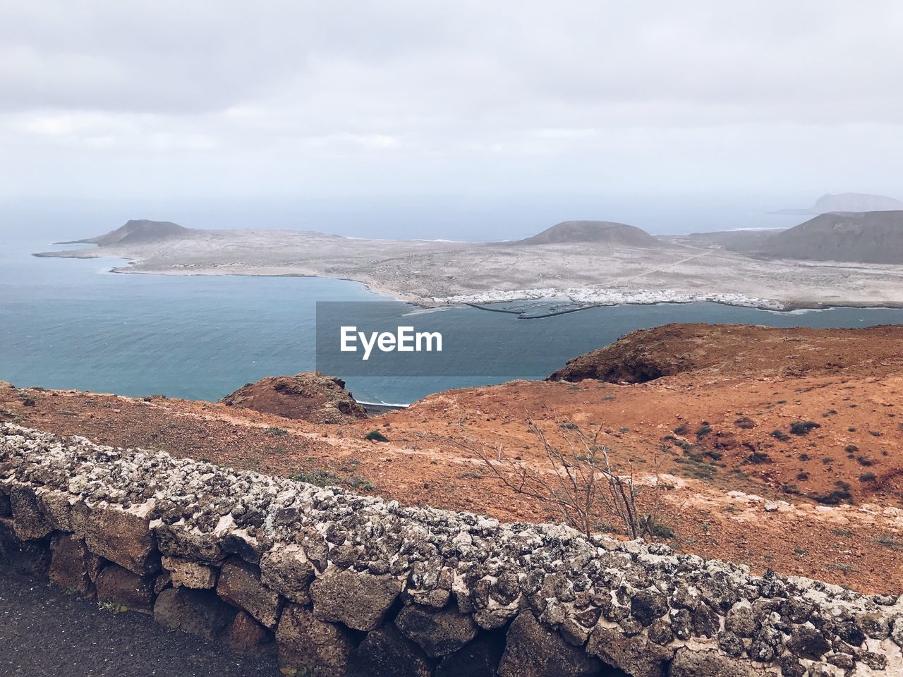 SCENIC VIEW OF SEA AND ROCKS AGAINST SKY