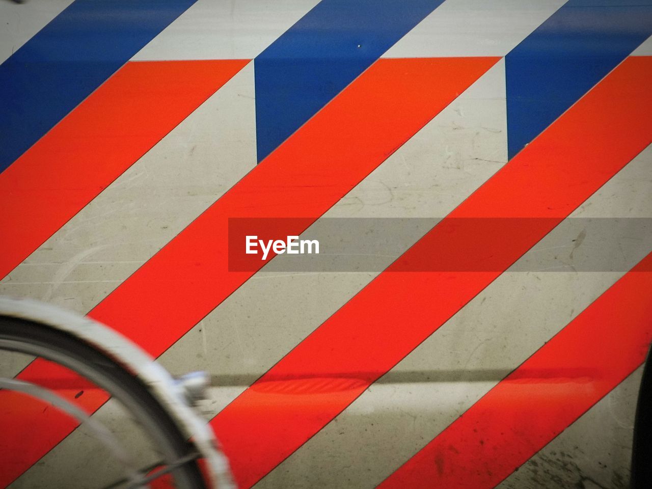 Red and blue stripes on police car