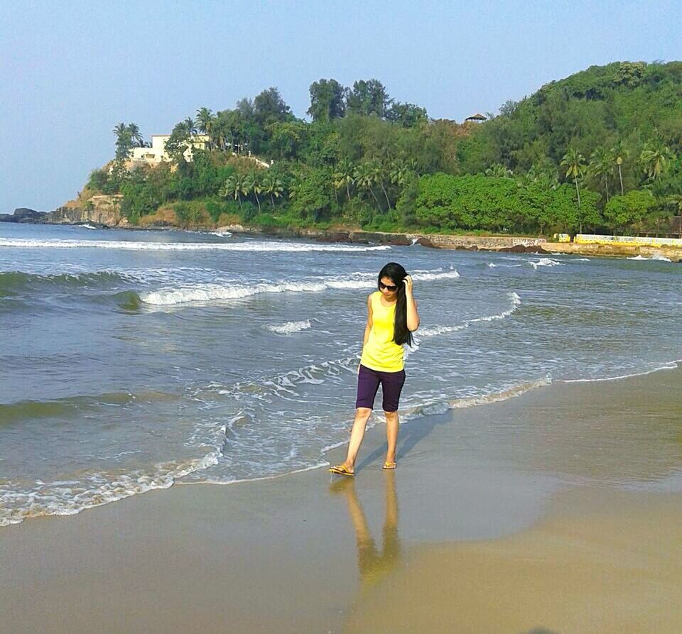 WOMAN STANDING ON SHORE