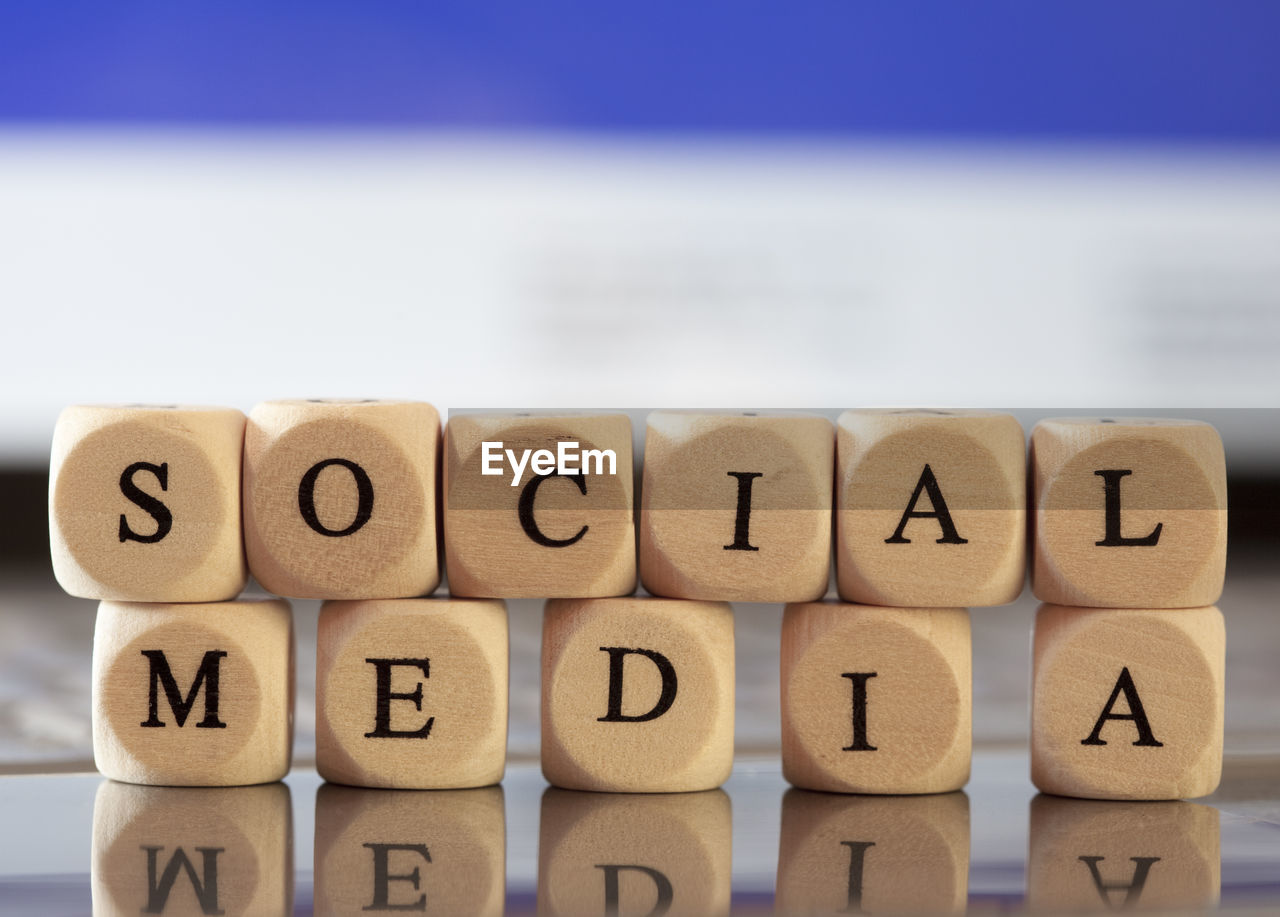 Social media text made with wooden blocks on table
