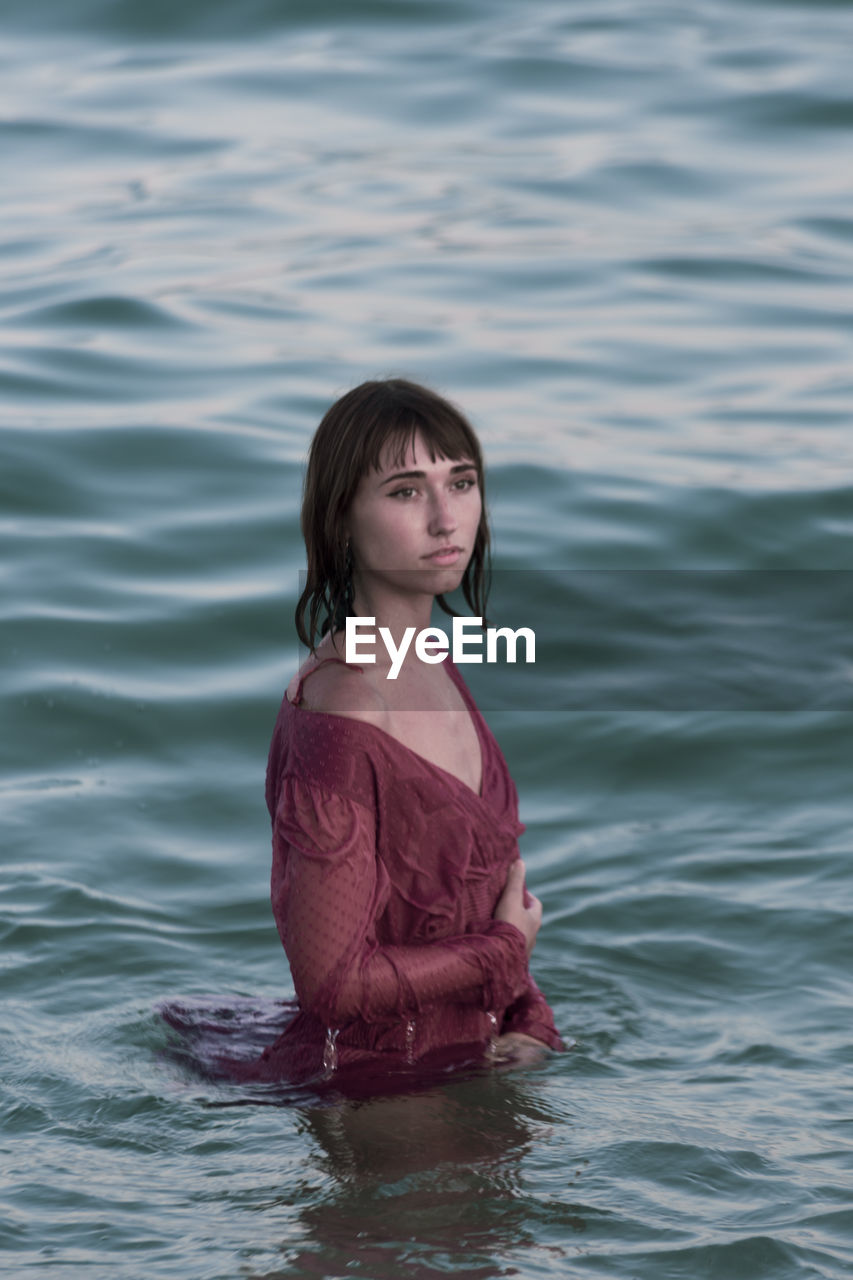 Portrait of woman against sea