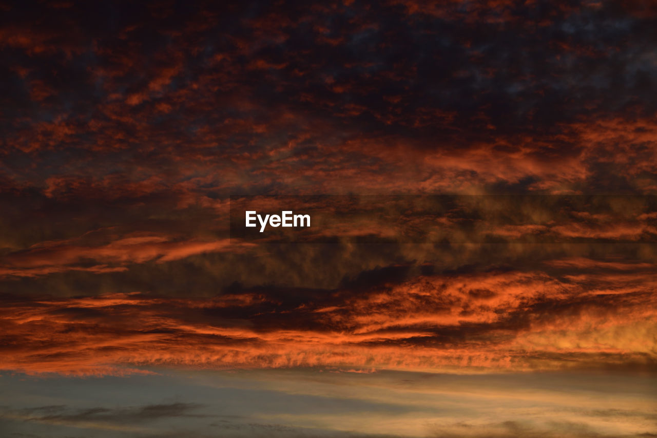 Low angle view of dramatic sky during sunset