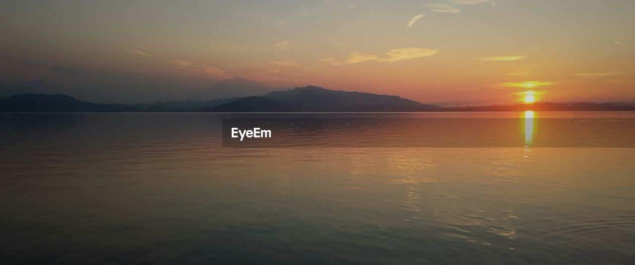 Tranquil scene of lake during sunset