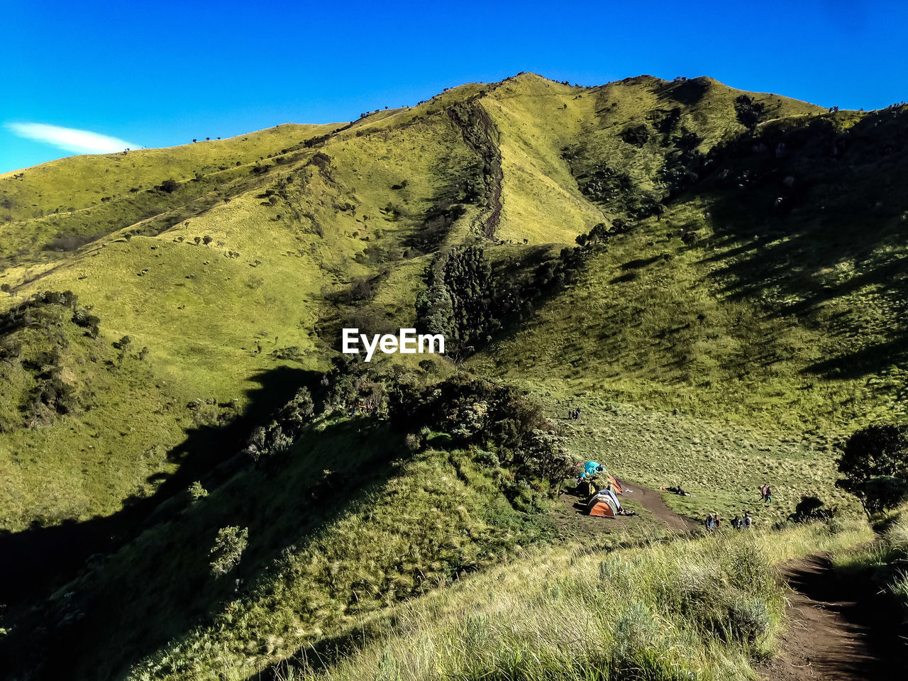 Shadow of person riding on mountain