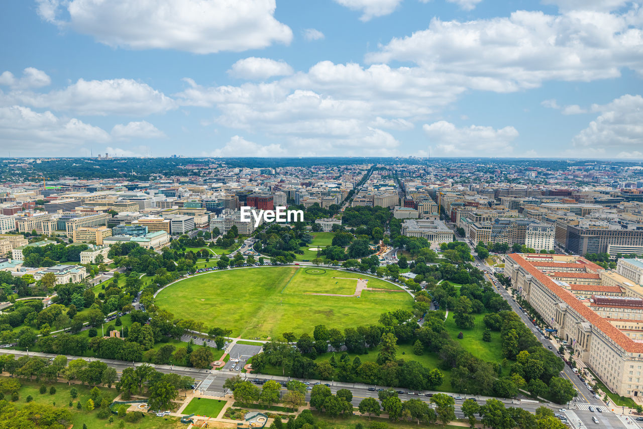 HIGH ANGLE VIEW OF BUILDINGS AGAINST SKY