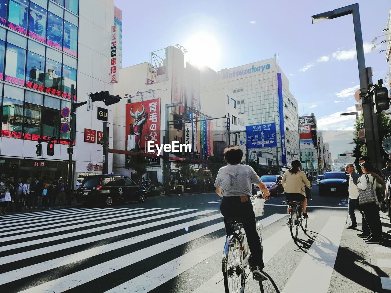 People riding bicycle on city street