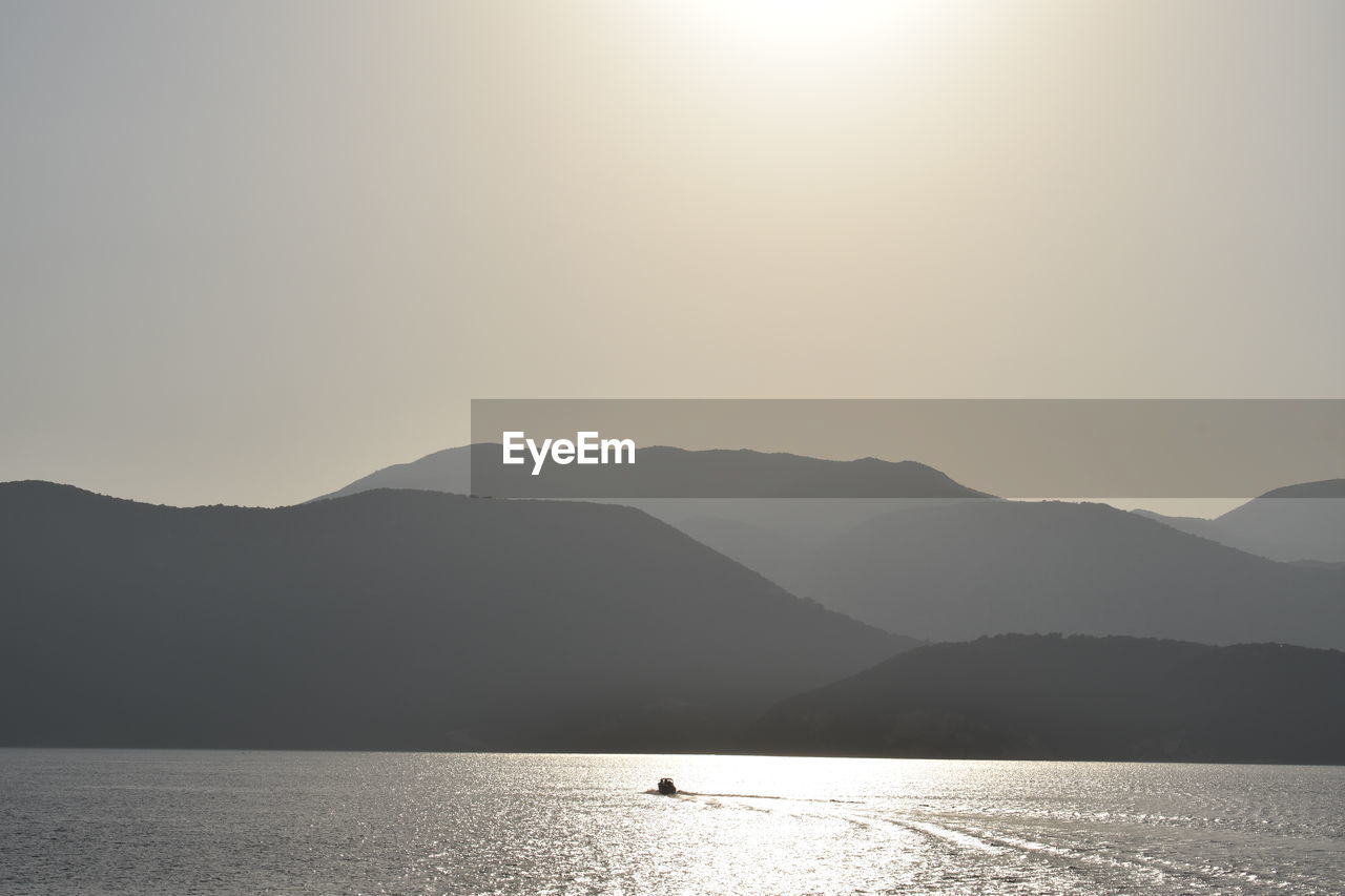 Scenic view of mountains against sky during sunset