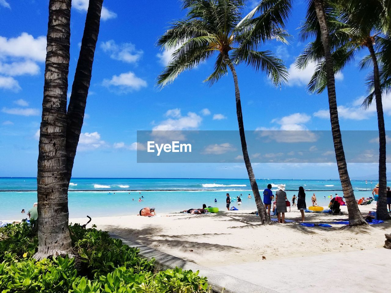 Scenic view of beach against blue sky