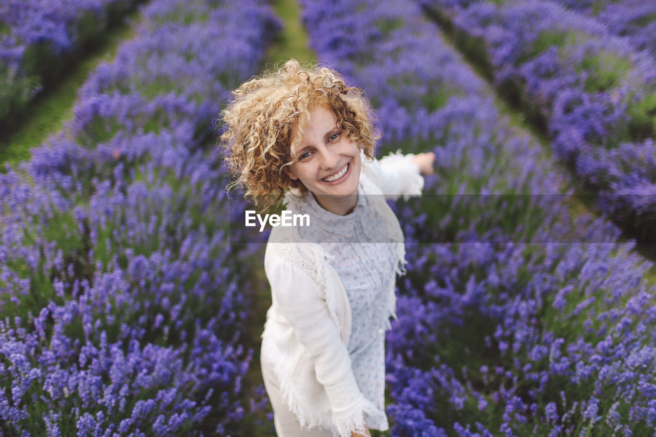Portrait of woman enjoying on lavender field
