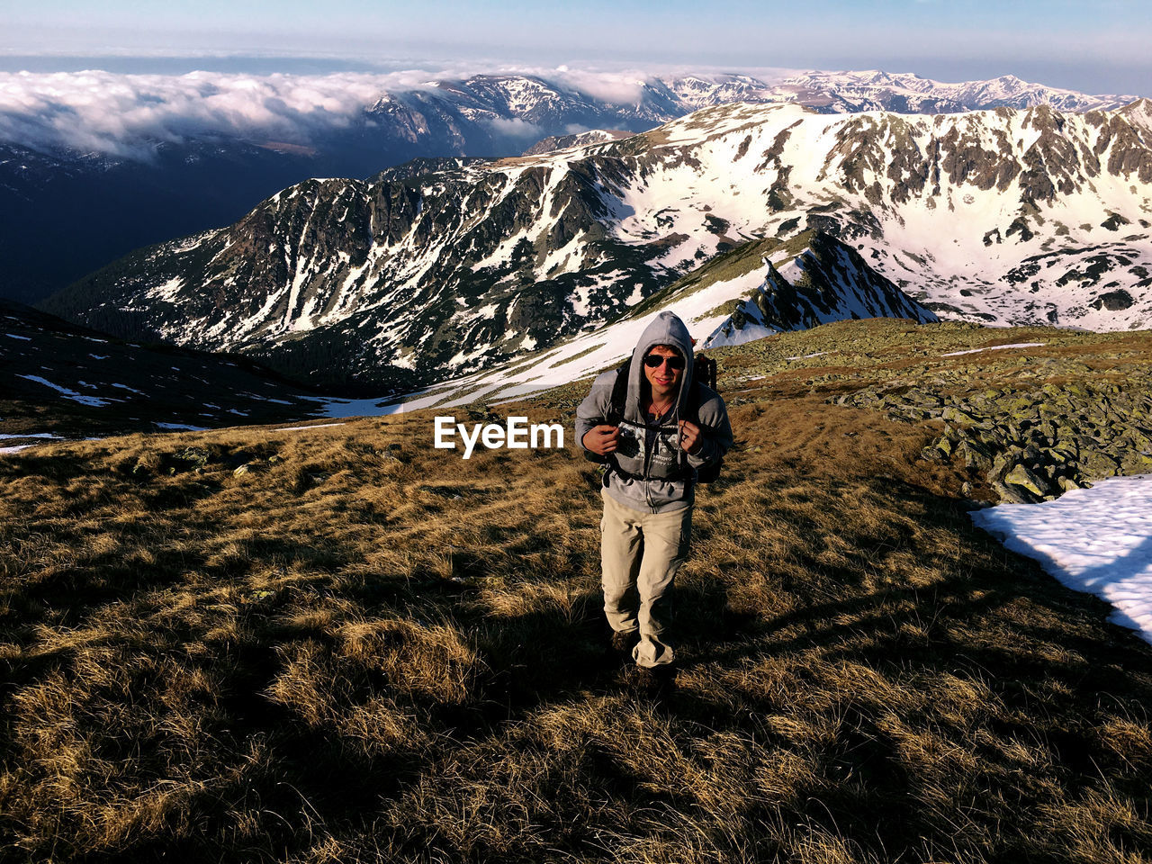 High angle view of man walking on mountain against sky