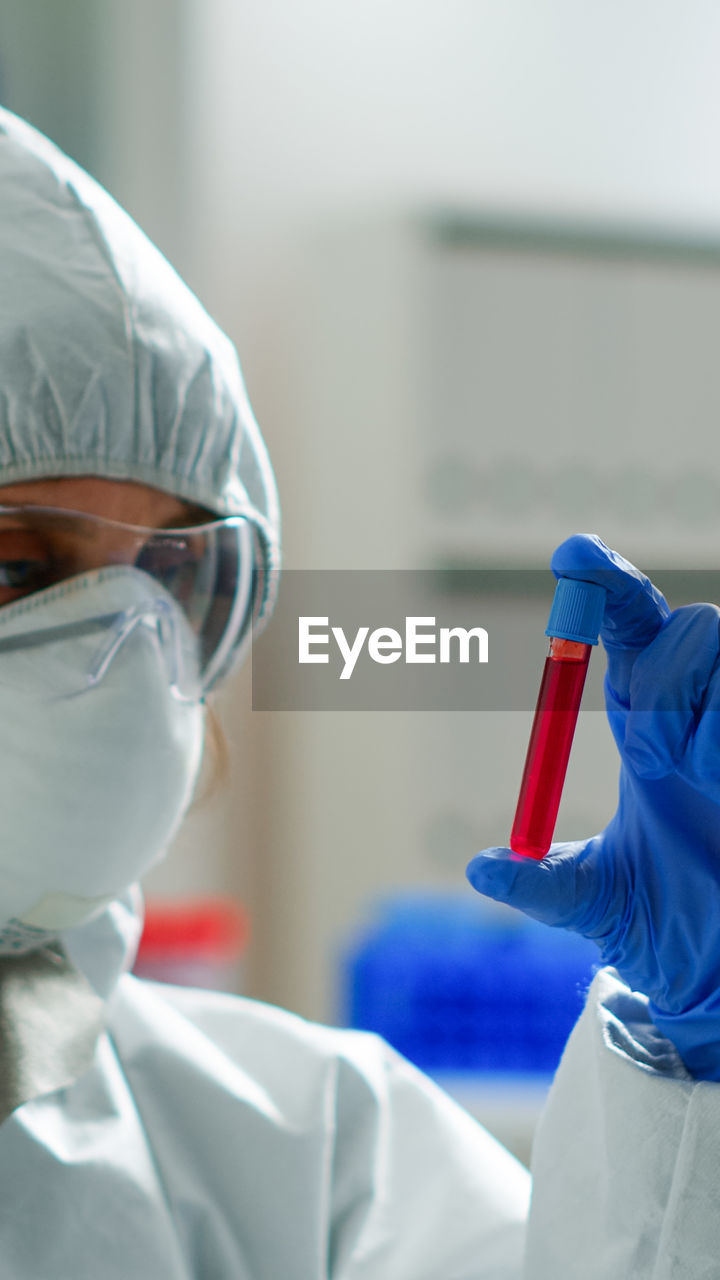 Doctor holding test tube at laboratory