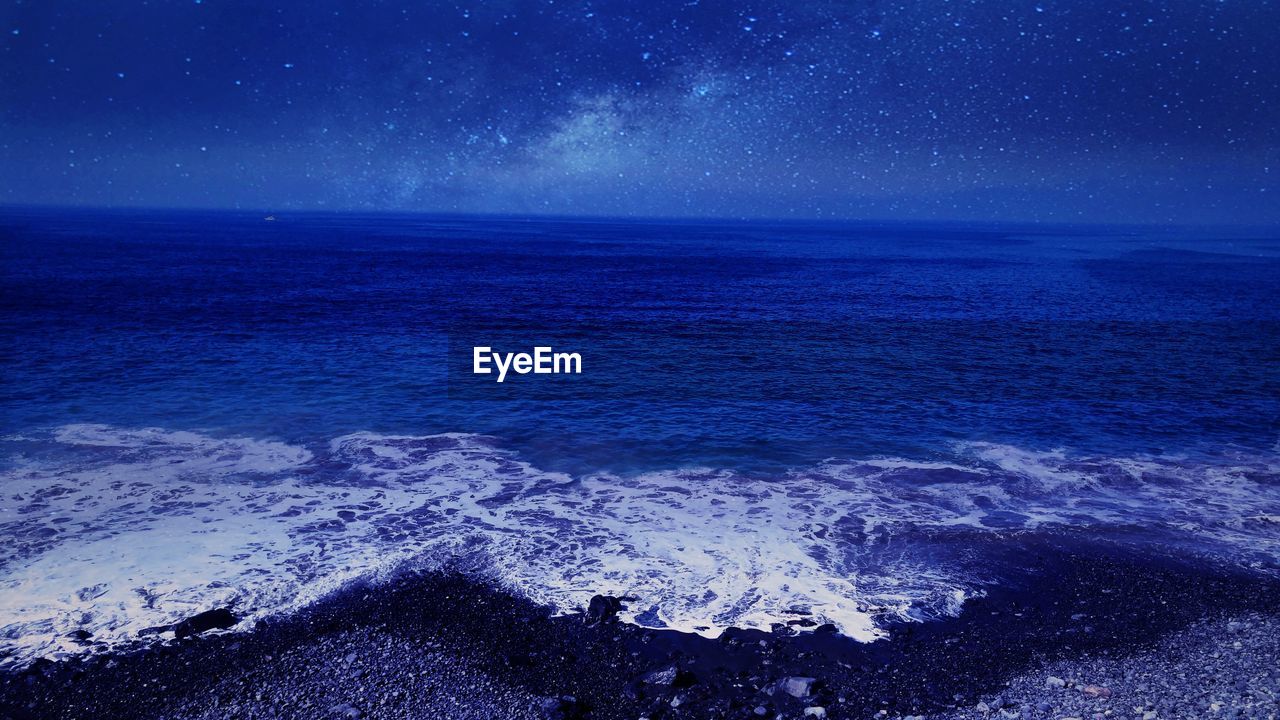 Scenic view of sea at night