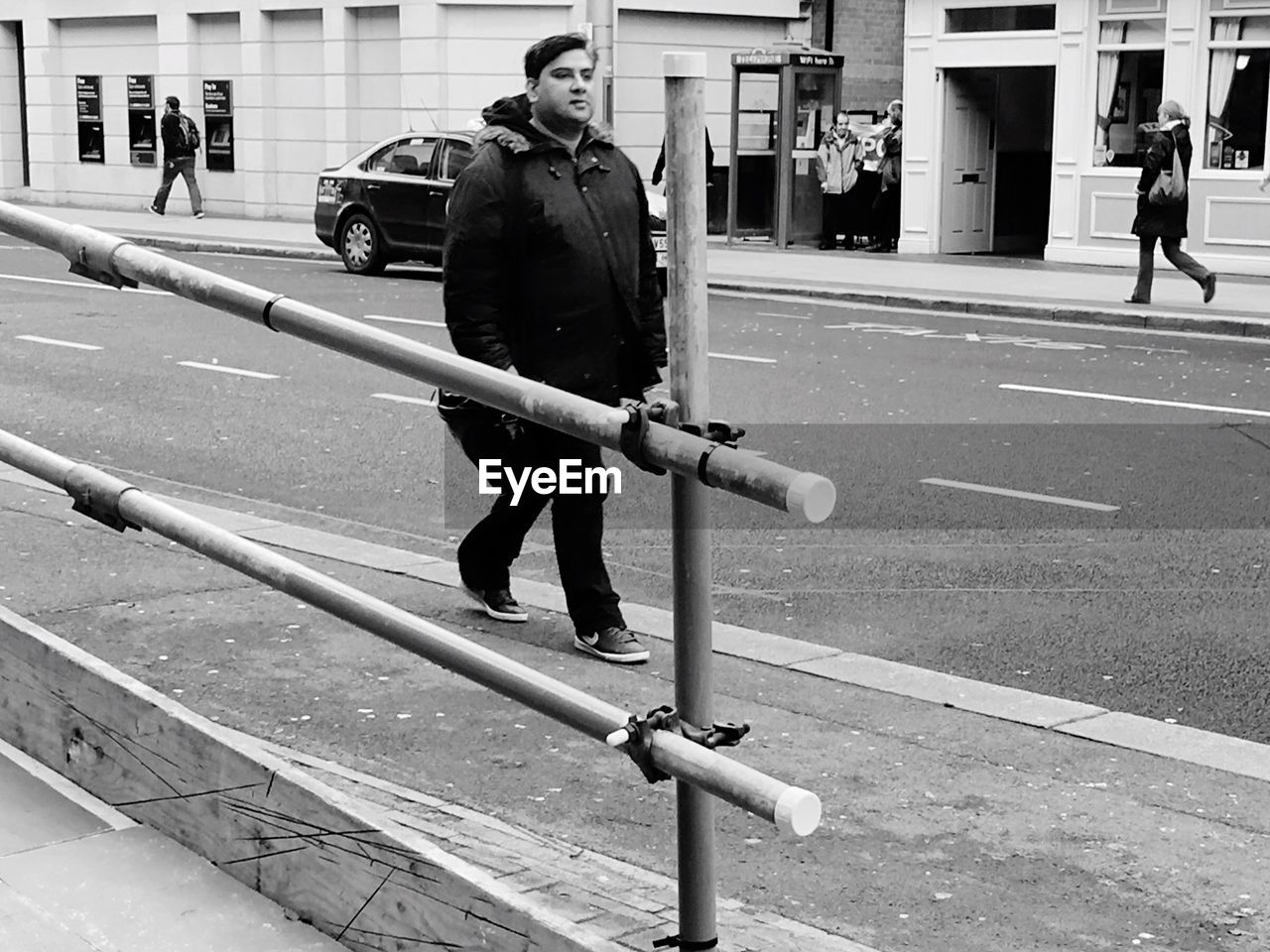 WOMAN WALKING ON ROAD