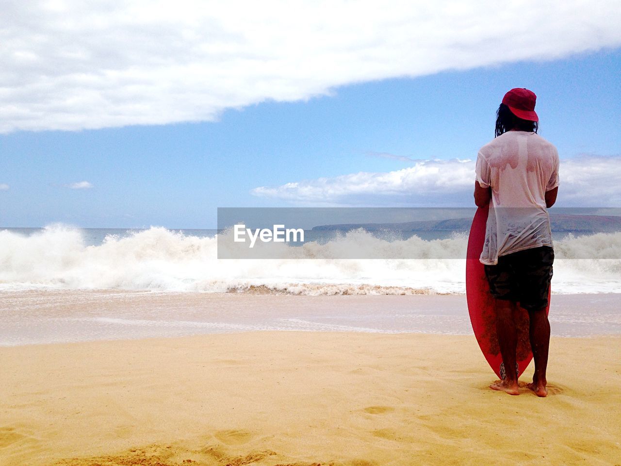 Rear view of man standing on beach