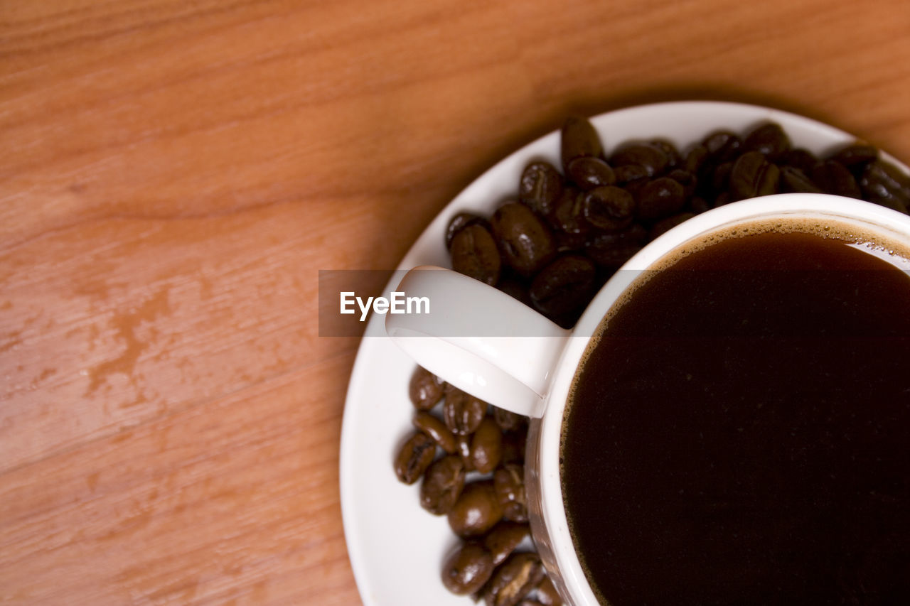 HIGH ANGLE VIEW OF COFFEE CUP AND TEA