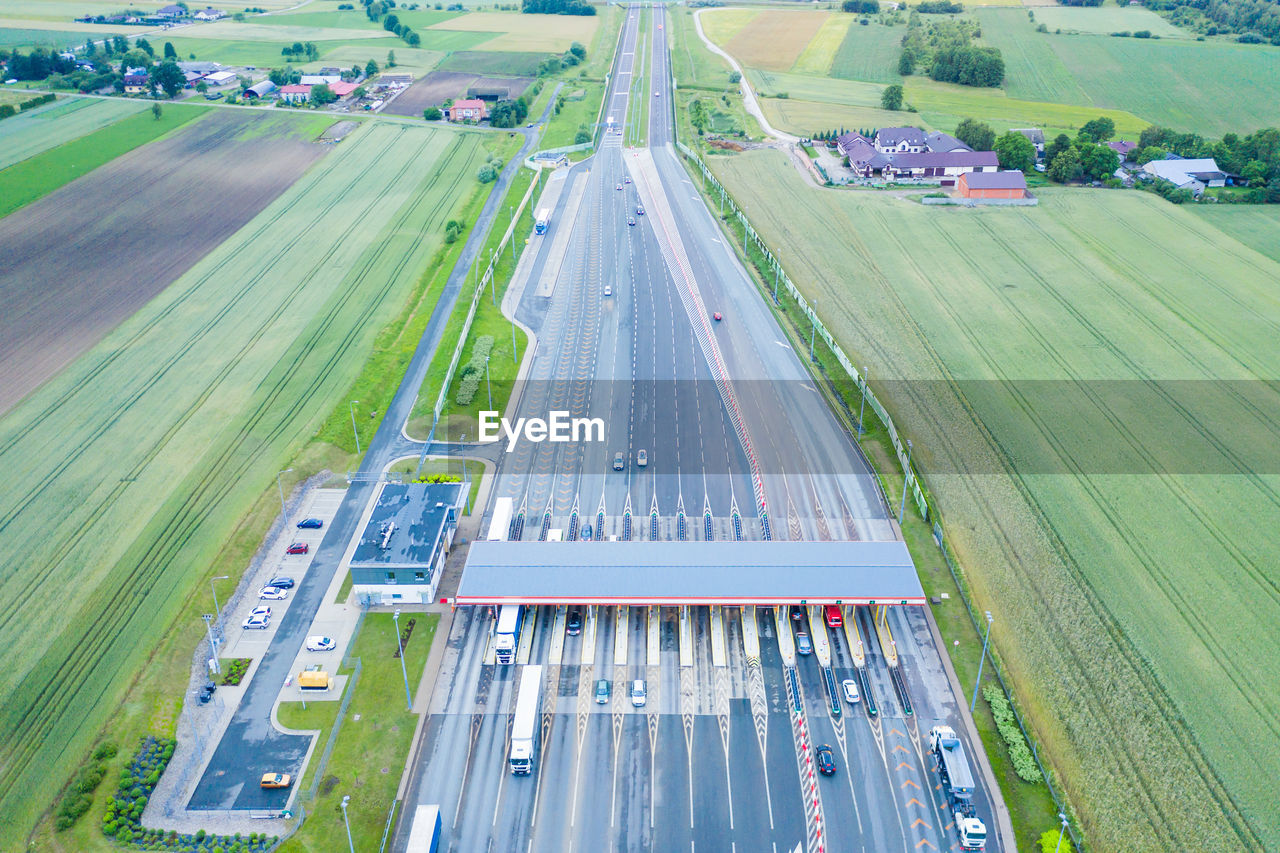 Car traffic transportation on multiple lanes highway road and toll collection gate .a2 poland lodz