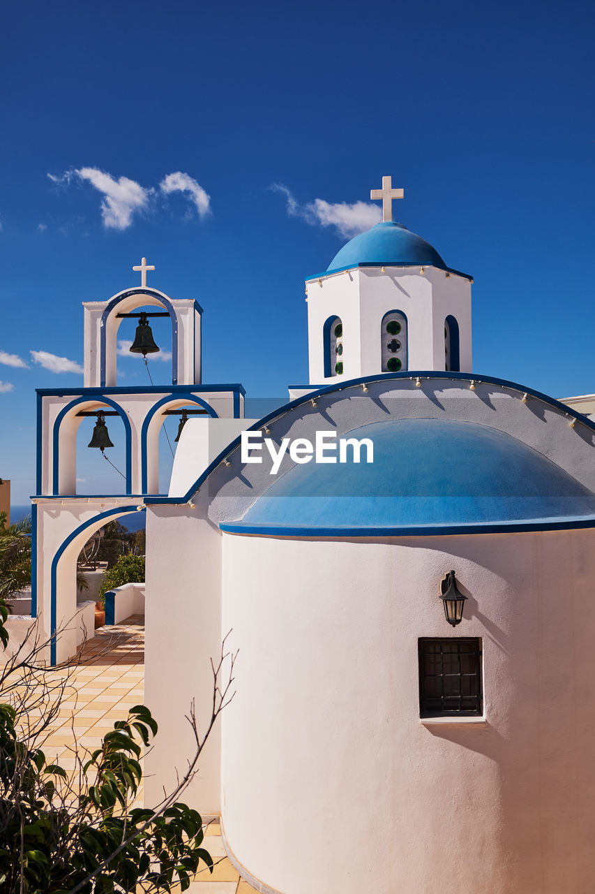 Saint anthony church - blue dome and bell tower - pyrgos village, santorini island, greece