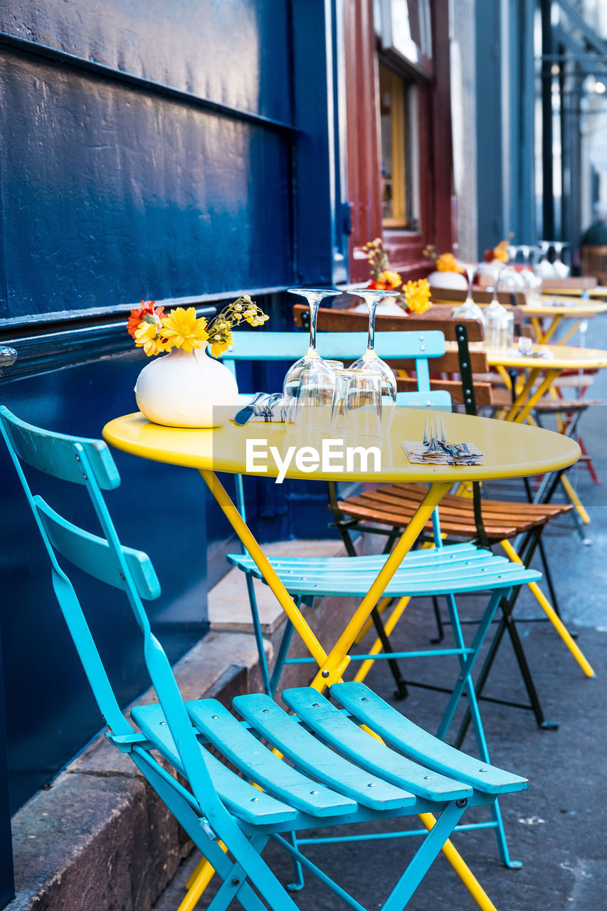 Empty chairs and tables at cafe