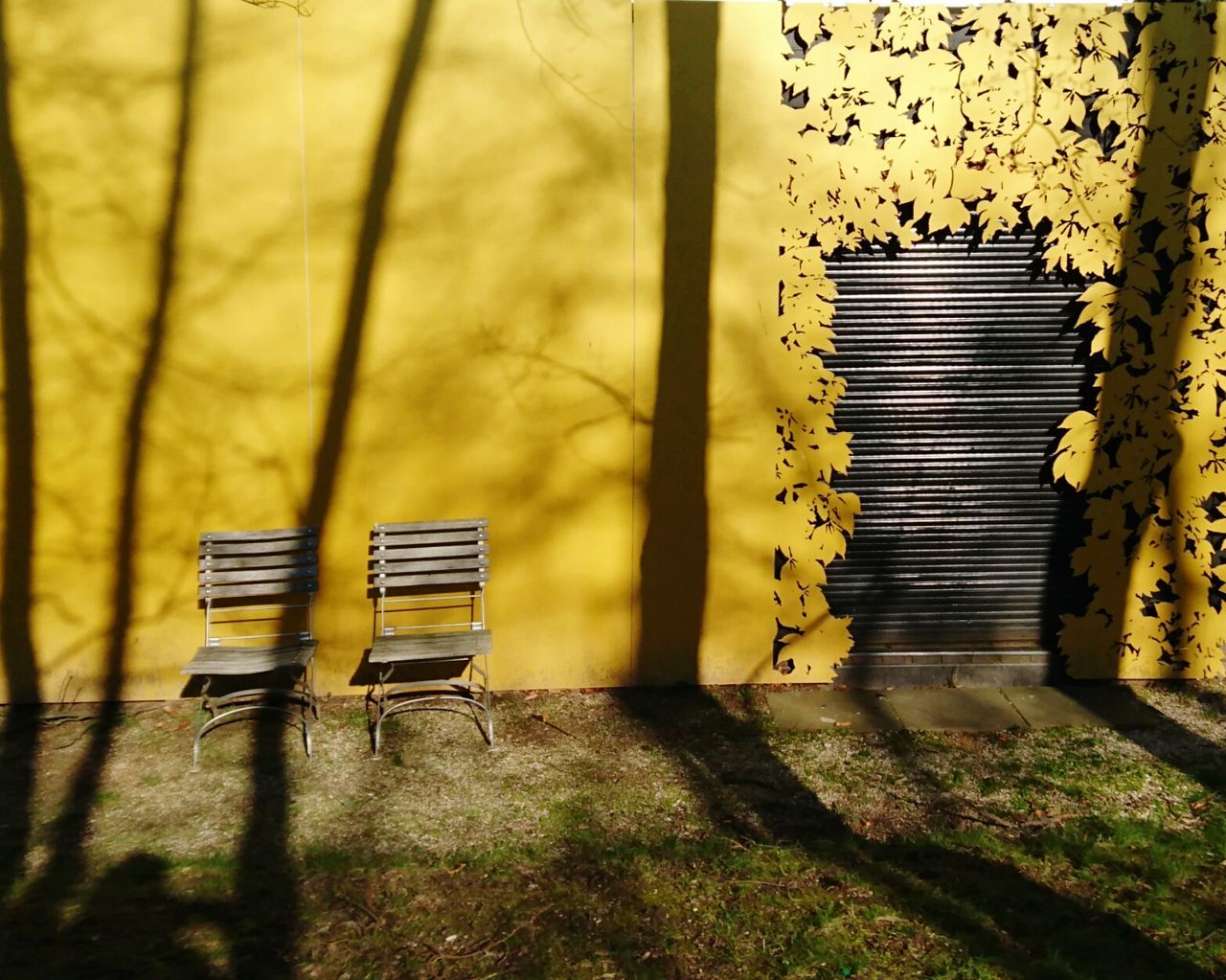 Empty chairs by house