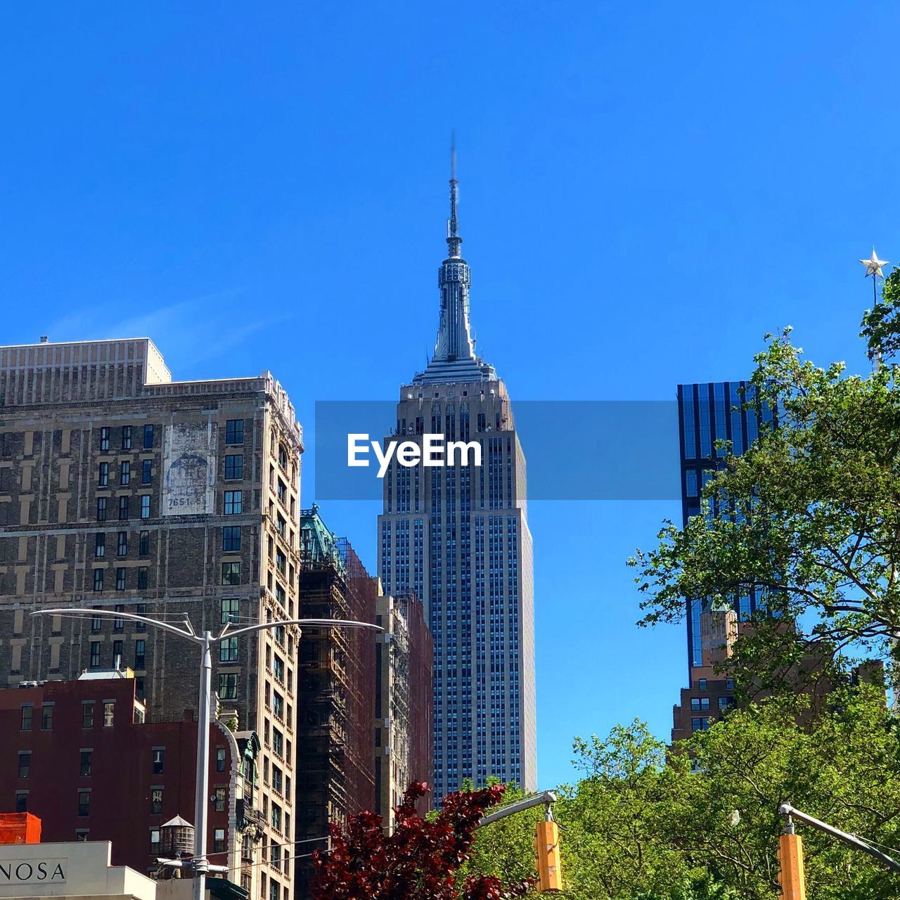 BUILDINGS AGAINST BLUE SKY