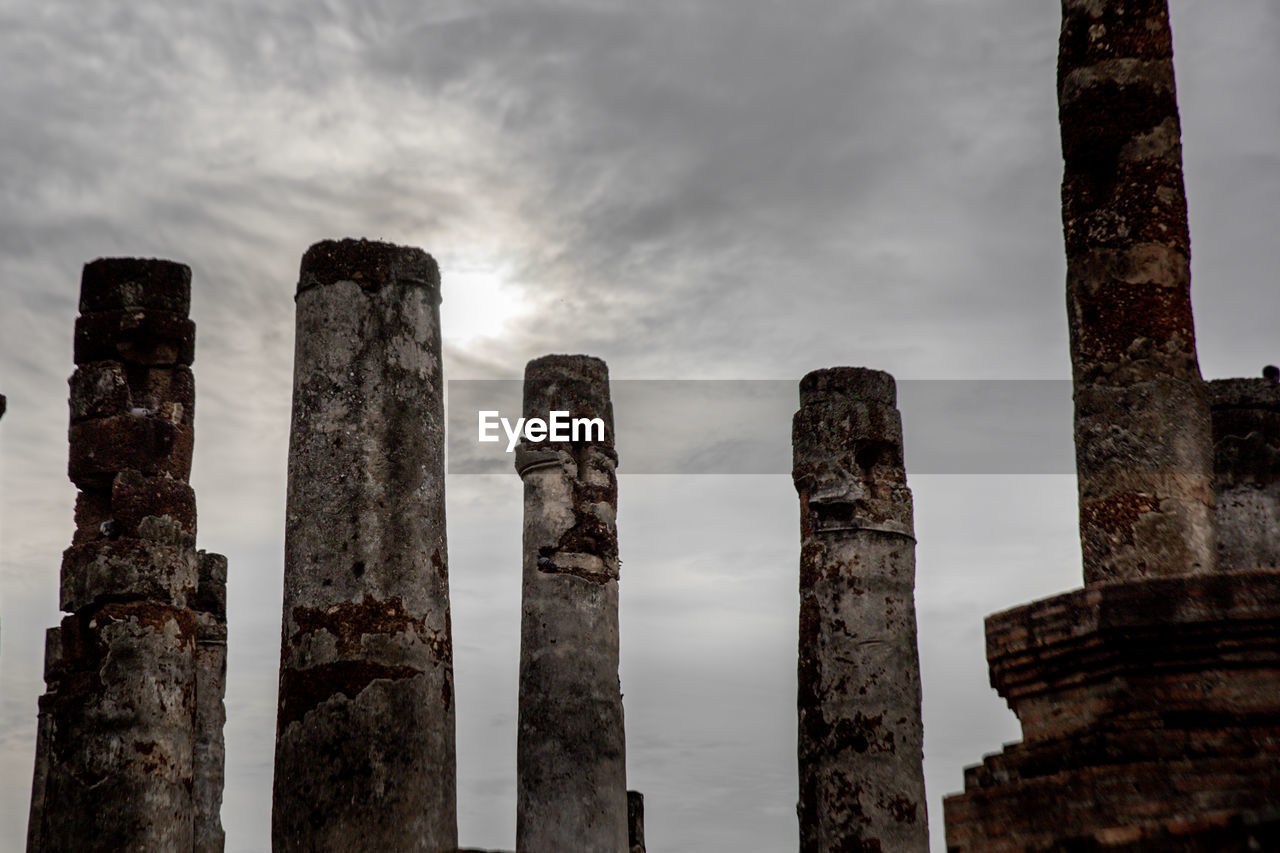 Low angle view of old ruins against sky